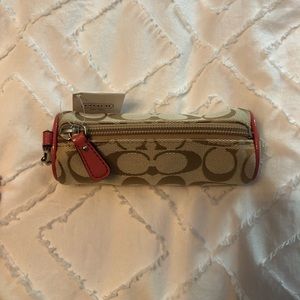 Coach golf ball holder